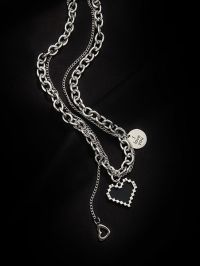 “Unveiling the Piper: The Mosaic Heart Pendant Necklace that Redefines Stainless Steel Fashion”