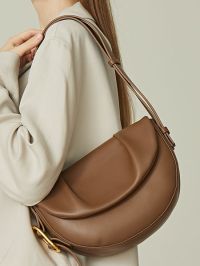 “Autumn Elegance: The Versatility of the Semi-Moon Genuine Leather Saddle Bag in Classic Fall Shades”